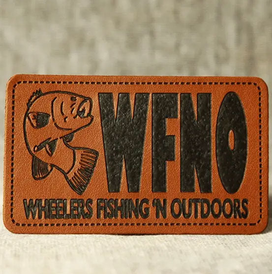 Flat lay of custom leather patches – classic shapes, engraved branding, USA-made